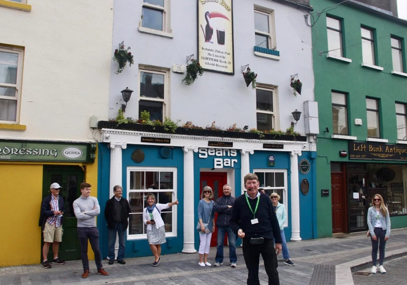 Guide taking tourists through the town as part of Athlone Guided Tours.